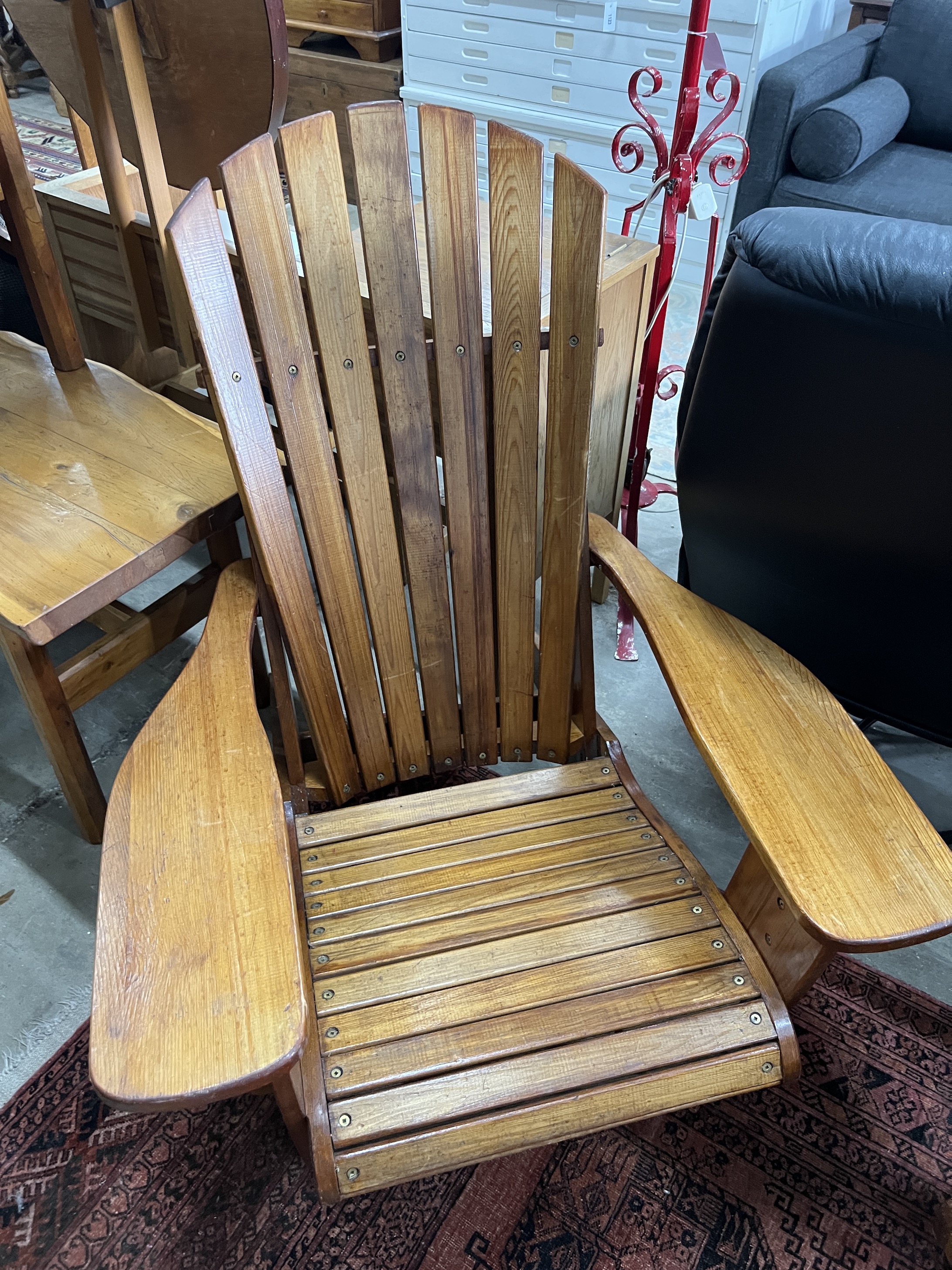 A pair of pine Adirondack chairs, stamped P J Appleby, width 79cm, depth 90cm, height 94cm